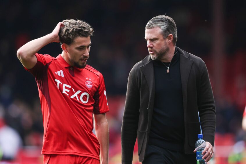 Aberdeen's Adil Aouchiche (L) and manager Jimmy Thelin at full-time after a 4-0 win against Dundee at Pittodrie.