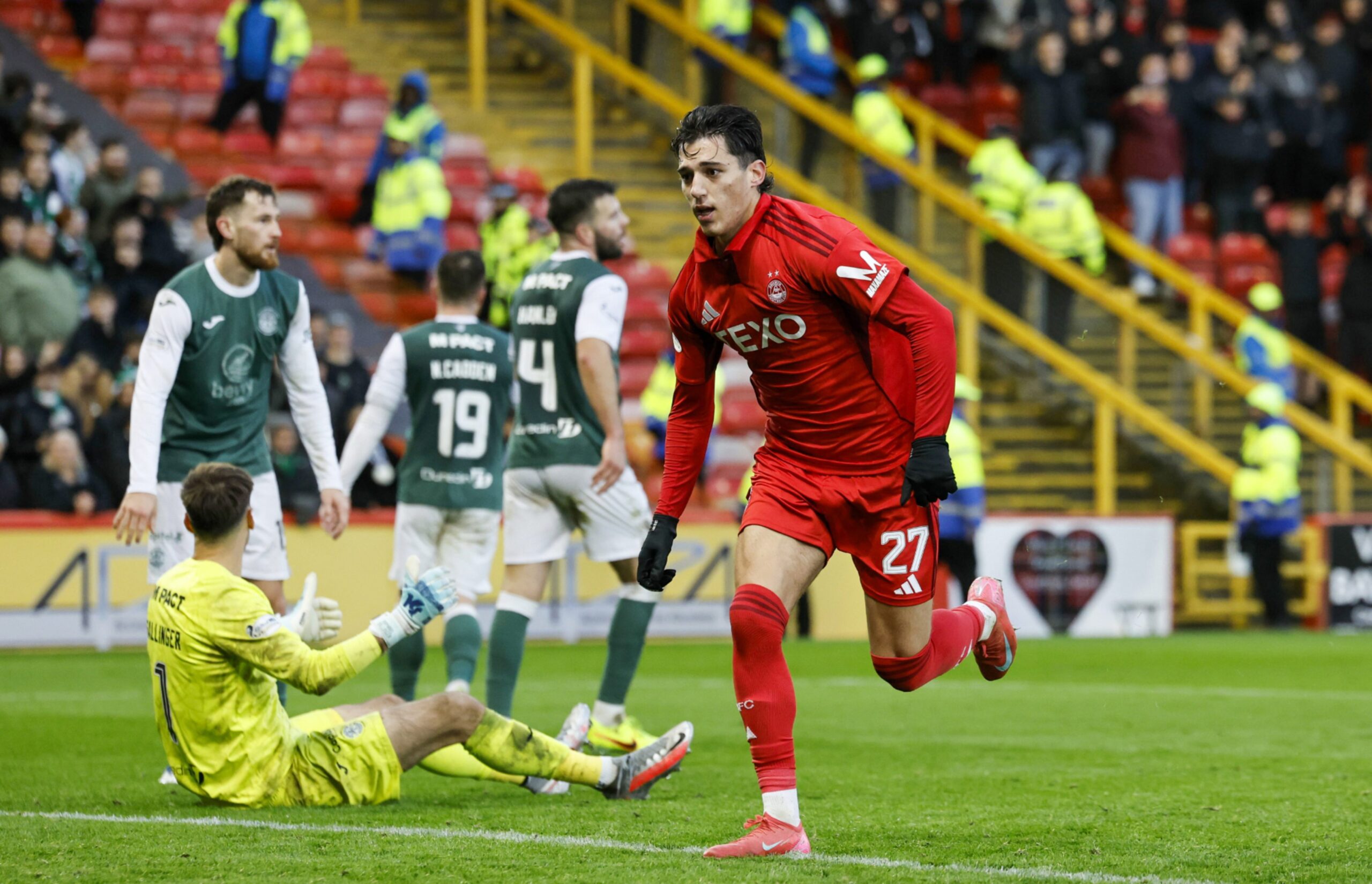 Aberdeen's Marko Lazetic gathers the ball after scoring to make it 2-1 against Hibs.