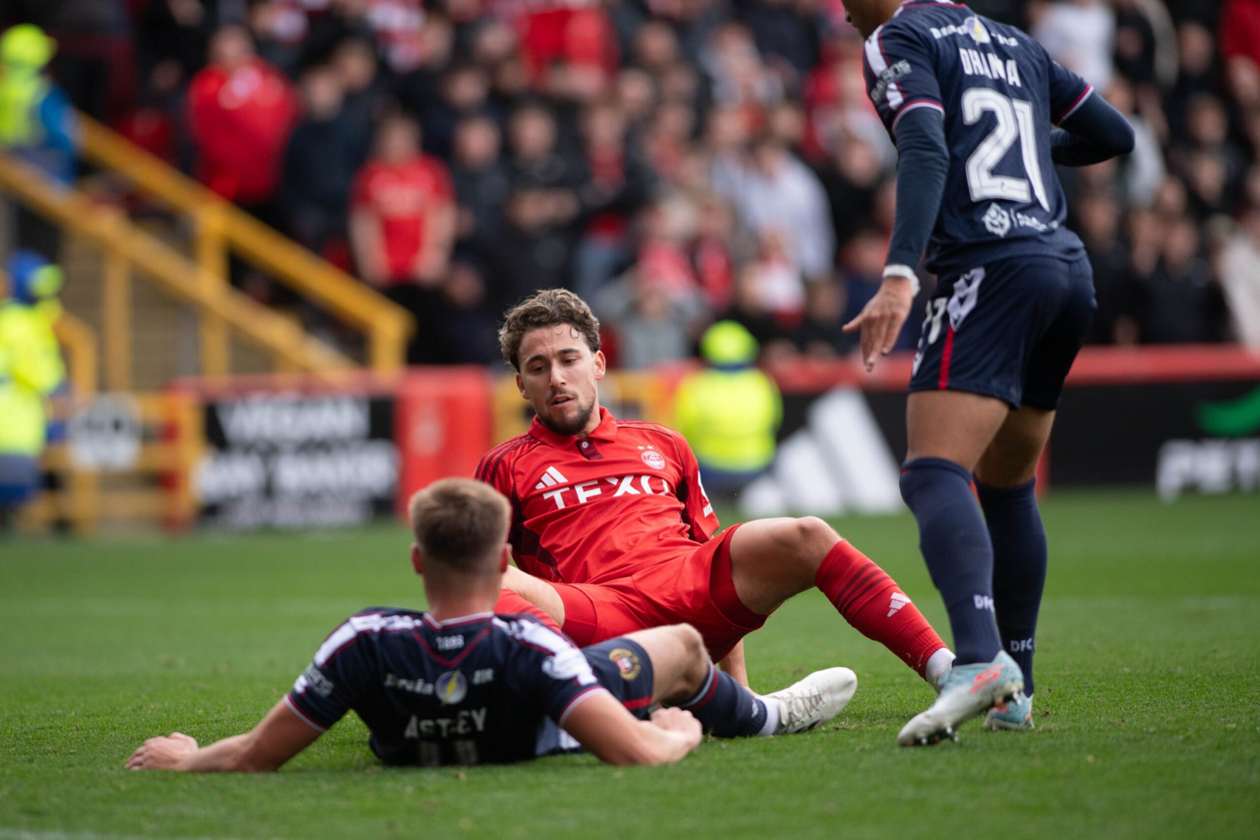Aberdeen's Adil Aouchiche scoring to make it 2-0 against Dundee.