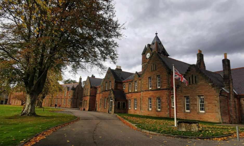 A military barracks building with Union Jack flag flying.