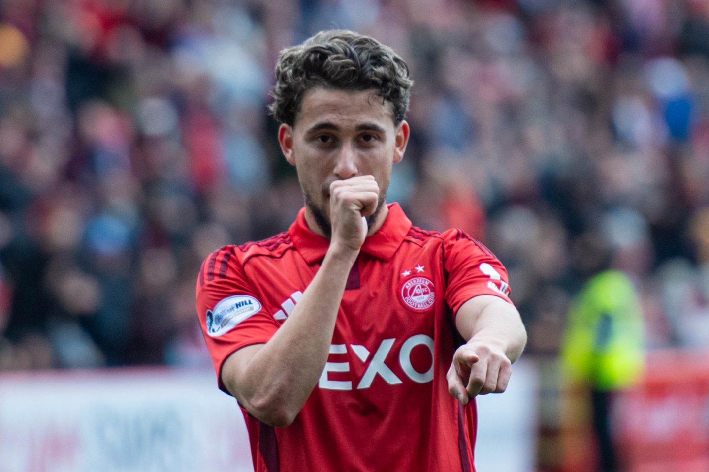 Aberdeen's Adil Aouchiche celebrates after scoring to make it 2-0 against Dundee.