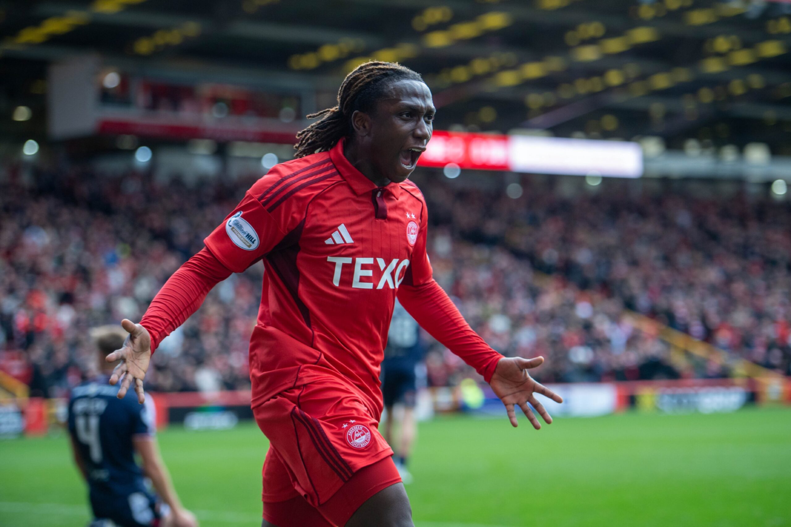 Aberdeen's Emmanuel Gymalfi celebrates after scoring to make it 3-0. against Dundee at Pittodrie.