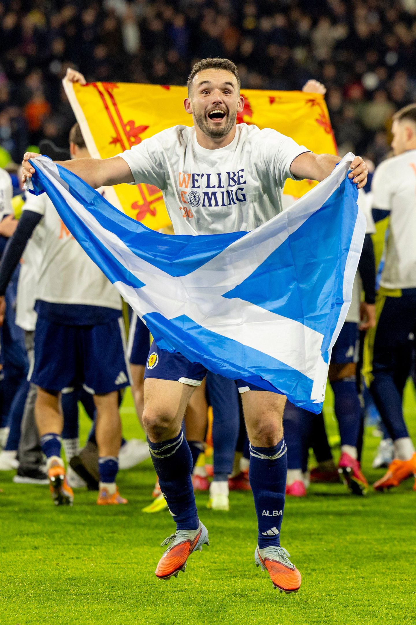Scotland midfielder John McGinn celebrates after the national team secured their World Cup spot against Denmark at Hampden last November. Image: Alan Rennie/Shutterstock