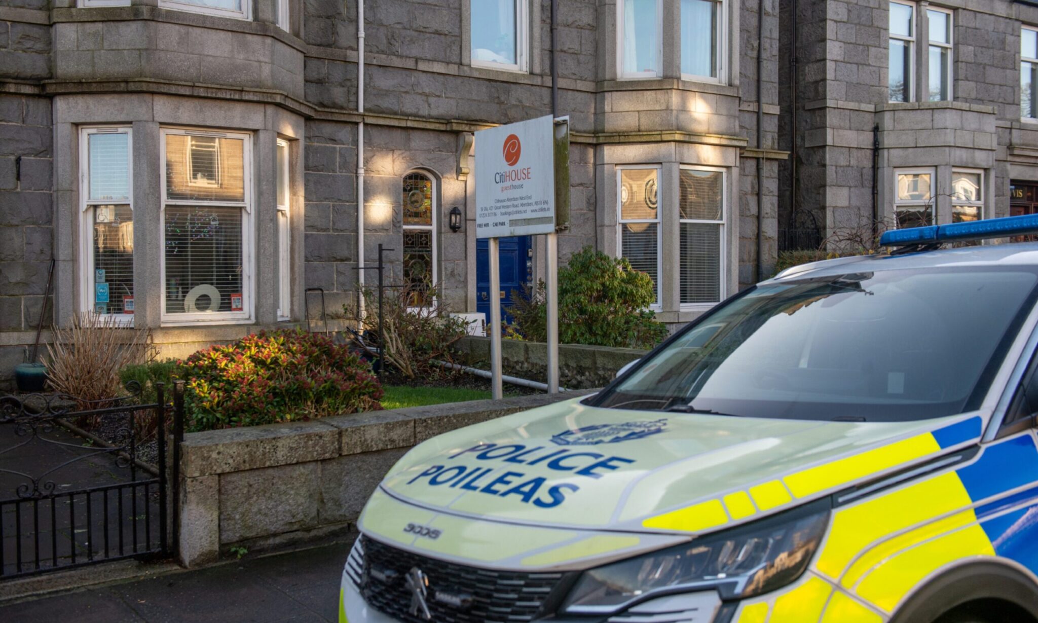 Police at Aberdeen guest house after armed officers called to scene