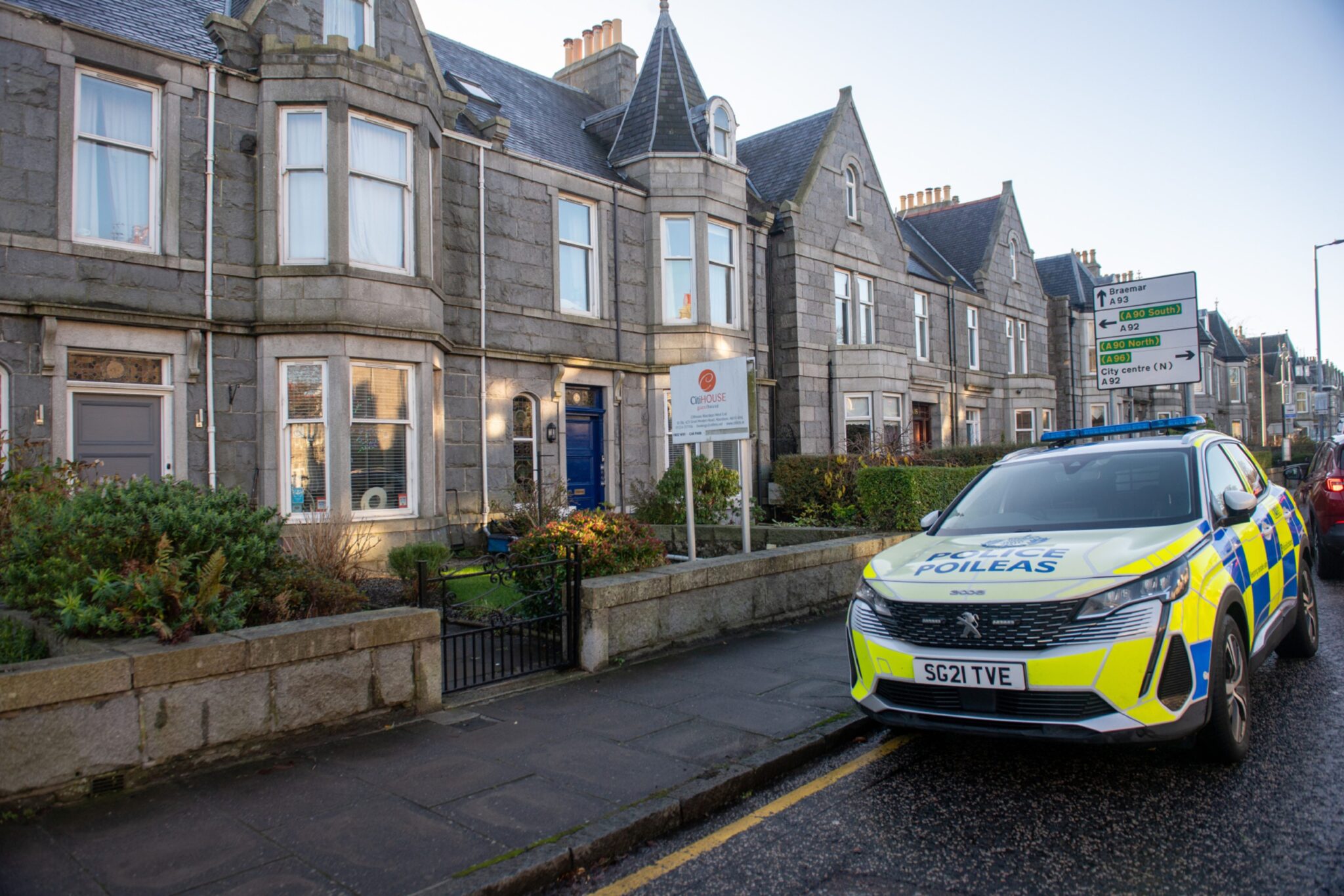 Police at Aberdeen guest house after armed officers called to scene