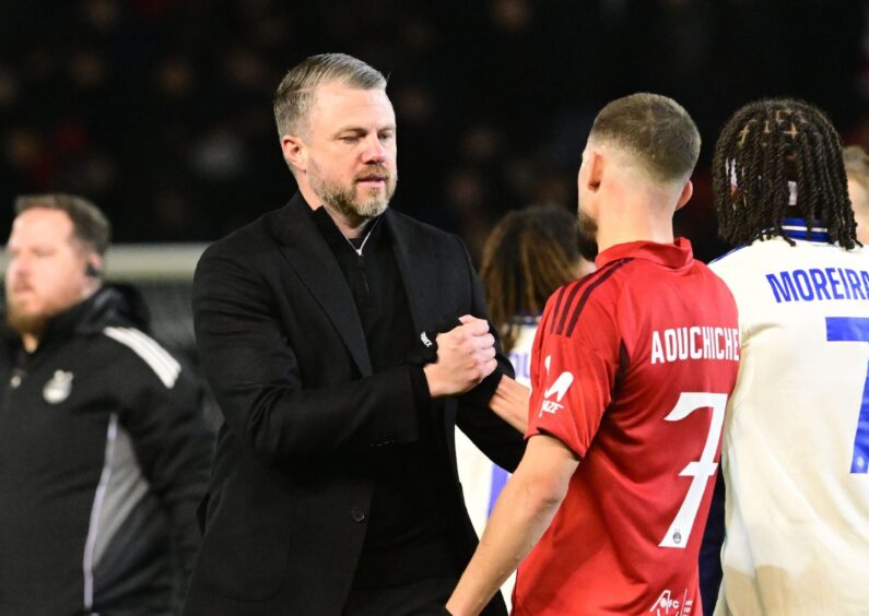 Aberdeen manager Jimmy Thelin with Adil Aouchiche at the final whistle of the Conference League clash with Strasbourg. Image: Shutterstock.