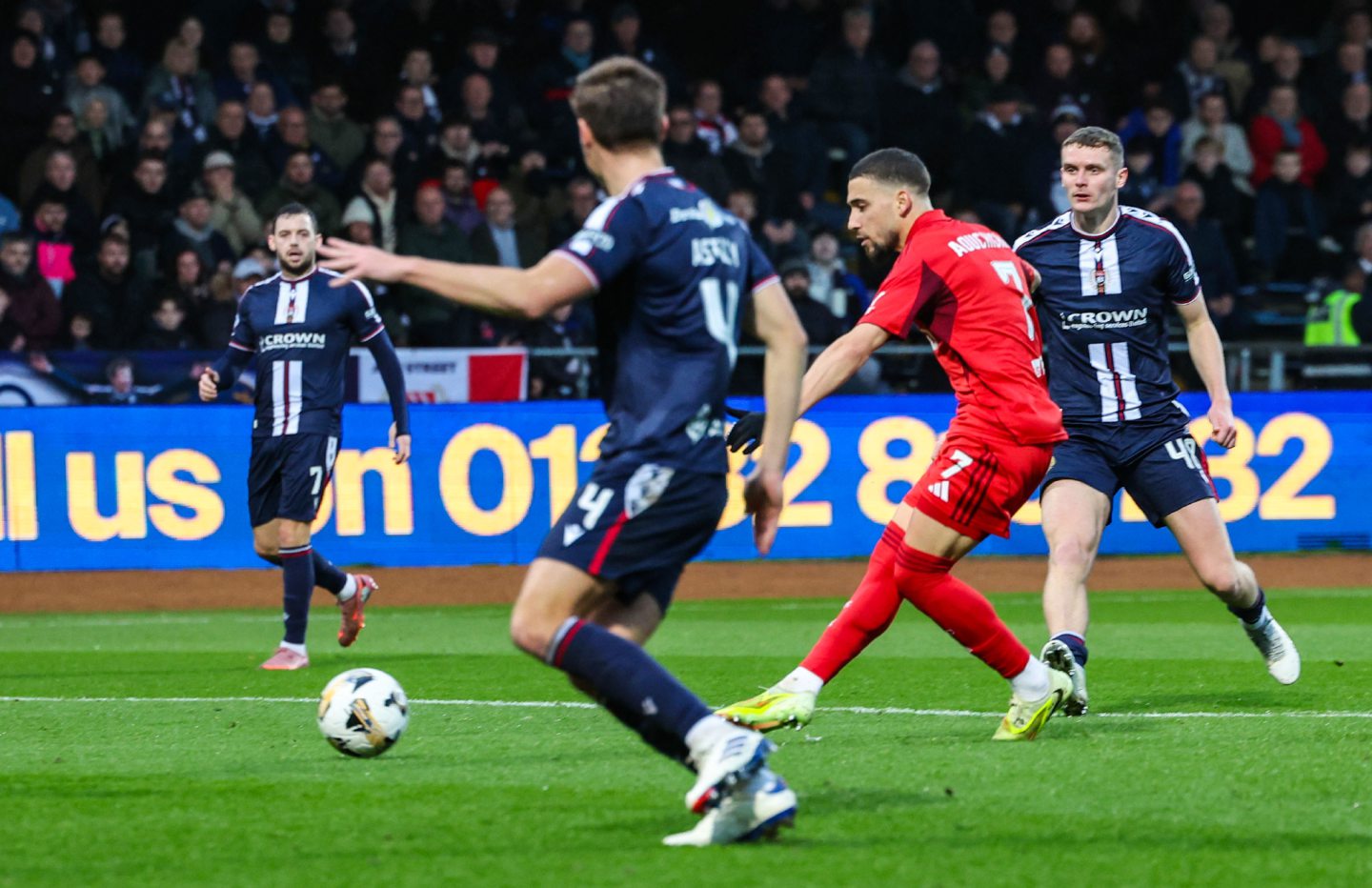 Aberdeen's Adil Aouchiche scores to make it 1-0 against Dundee at Dens Park.