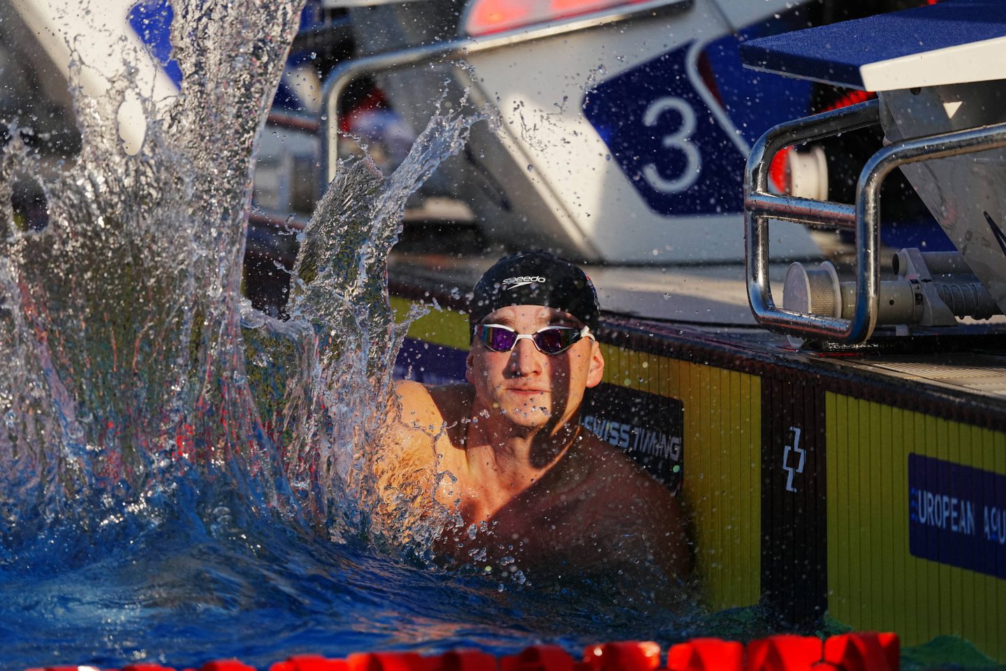 Dean in the pool splashing water