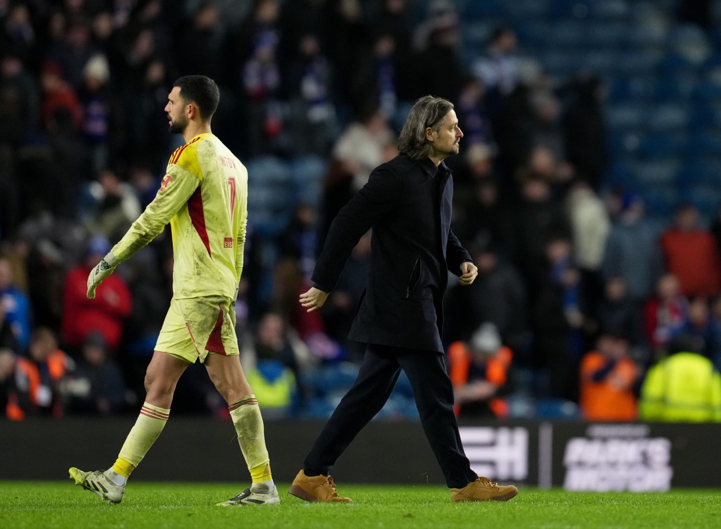 Aberdeen goalkeeper Dimitar Mitov on the pitch with sporting director Lutz Pfannenstiel at full-time after the 2-0 loss at Rangers