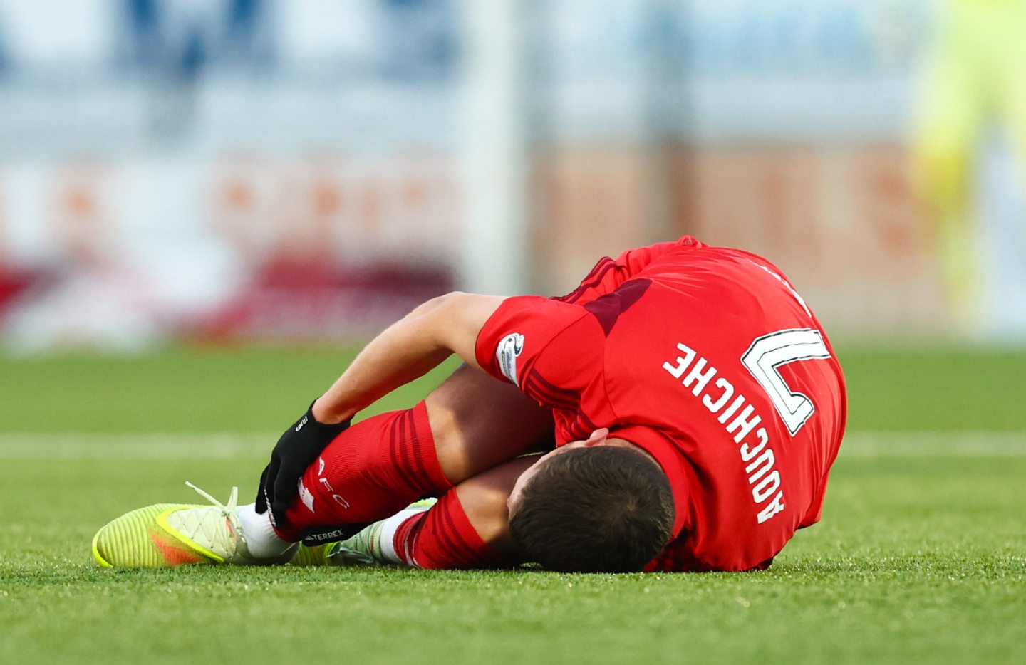 Aberdeen's Adil Aouchiche goes down injured during the Premiership match at Falkirk. 