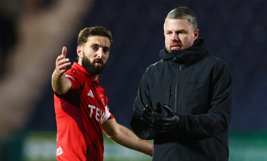 Aberdeen manager Jimmy Thelin and Graeme Shinnie (R) speak after their side's 1-0 loss at Falkirk.