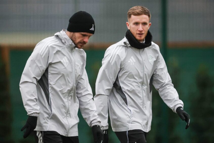 Liam Morrison walks beside another Dons player during an Aberdeen training session at Cormack Park, on January 23, 2026