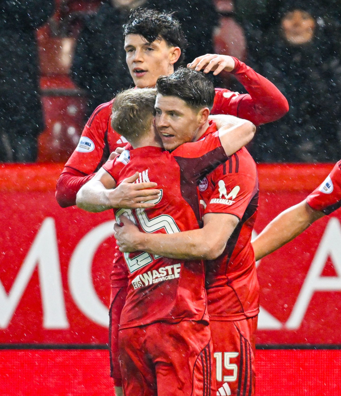 Aberdeen's Kevin Nisbet (R) celebrates scoring to make it 3-2 with teammates Lyall Cameron (L) and Jack Mline. Image: SNS