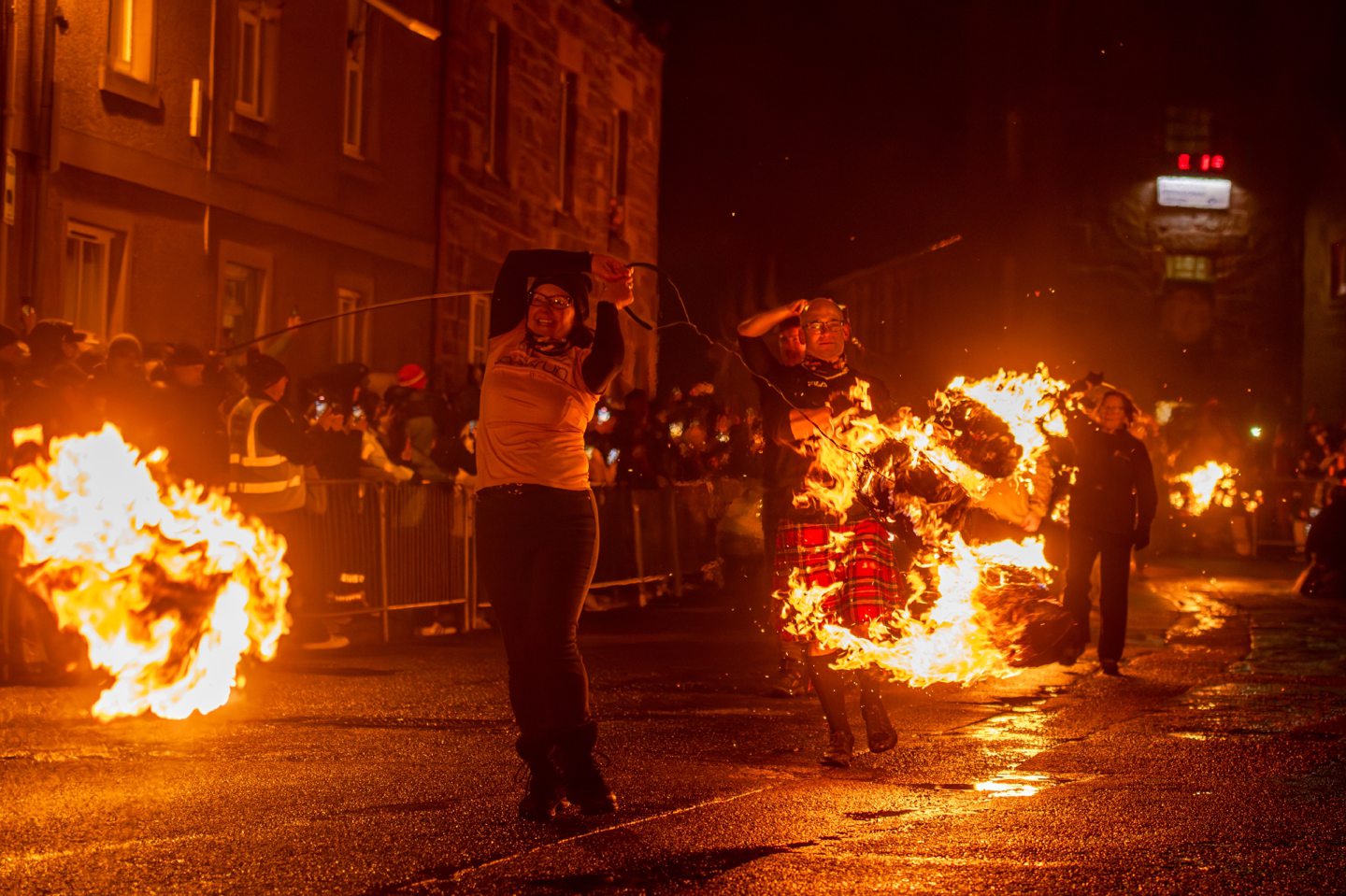 Fireball swingers march along Stonehaven High Street, spinning flaming fireballs during the Stonehaven Fireballs Hogmanay celebrations, January 1 2026.