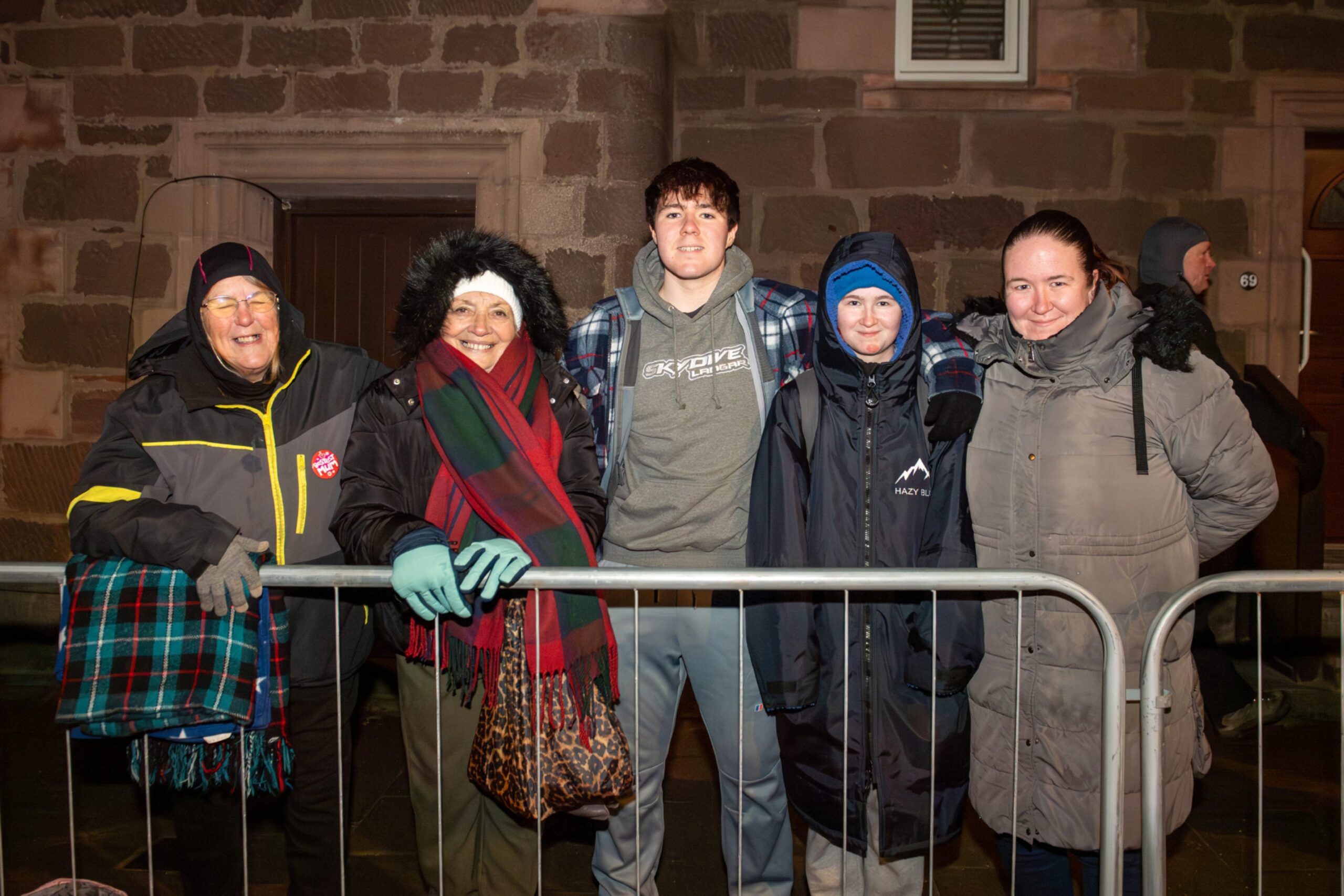 Marguerite Deeney celebrates her 80th birthday with family at the Stonehaven Fireballs event on Stonehaven High Street, January 1 2026.