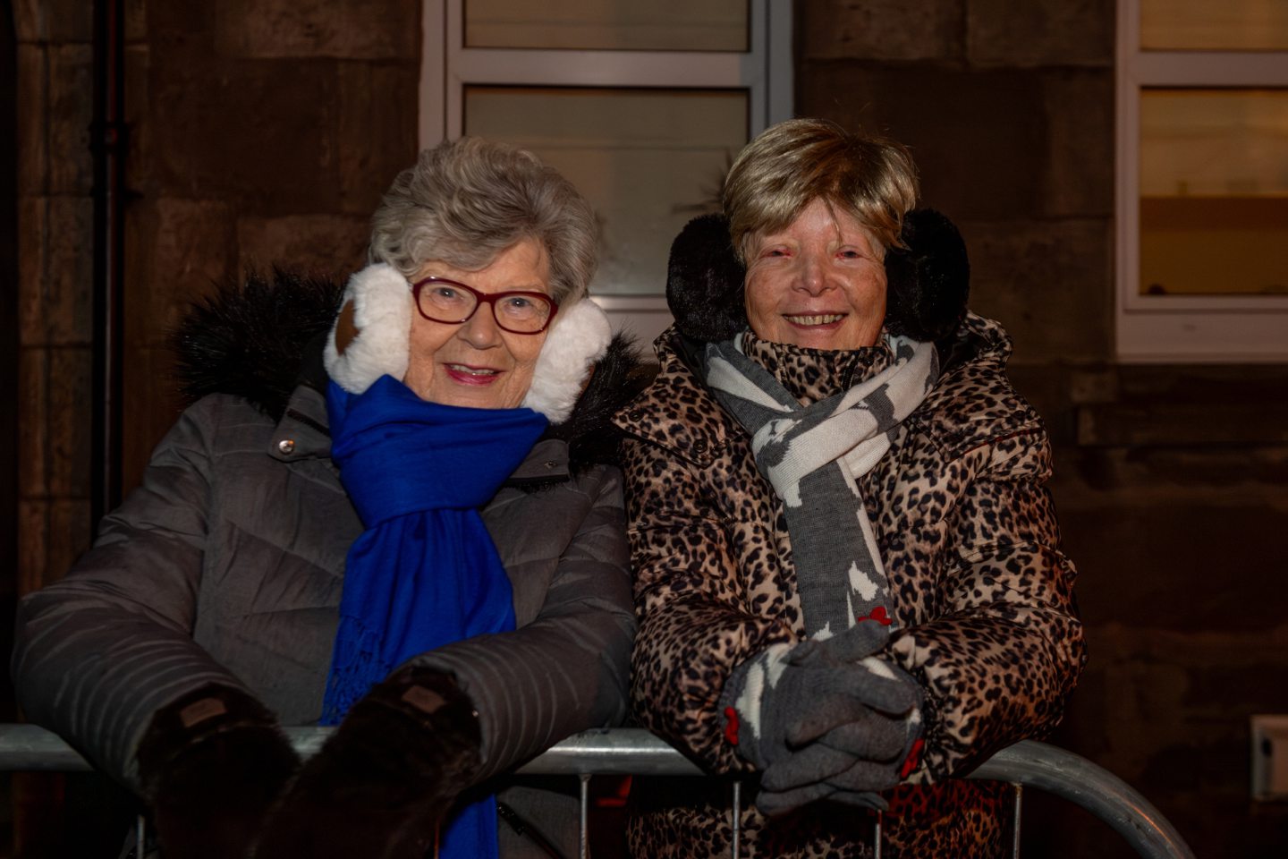 Anna and Janette watch the Stonehaven Fireballs Hogmanay celebrations while standing behind barriers on Stonehaven High Street, January 1 2026.