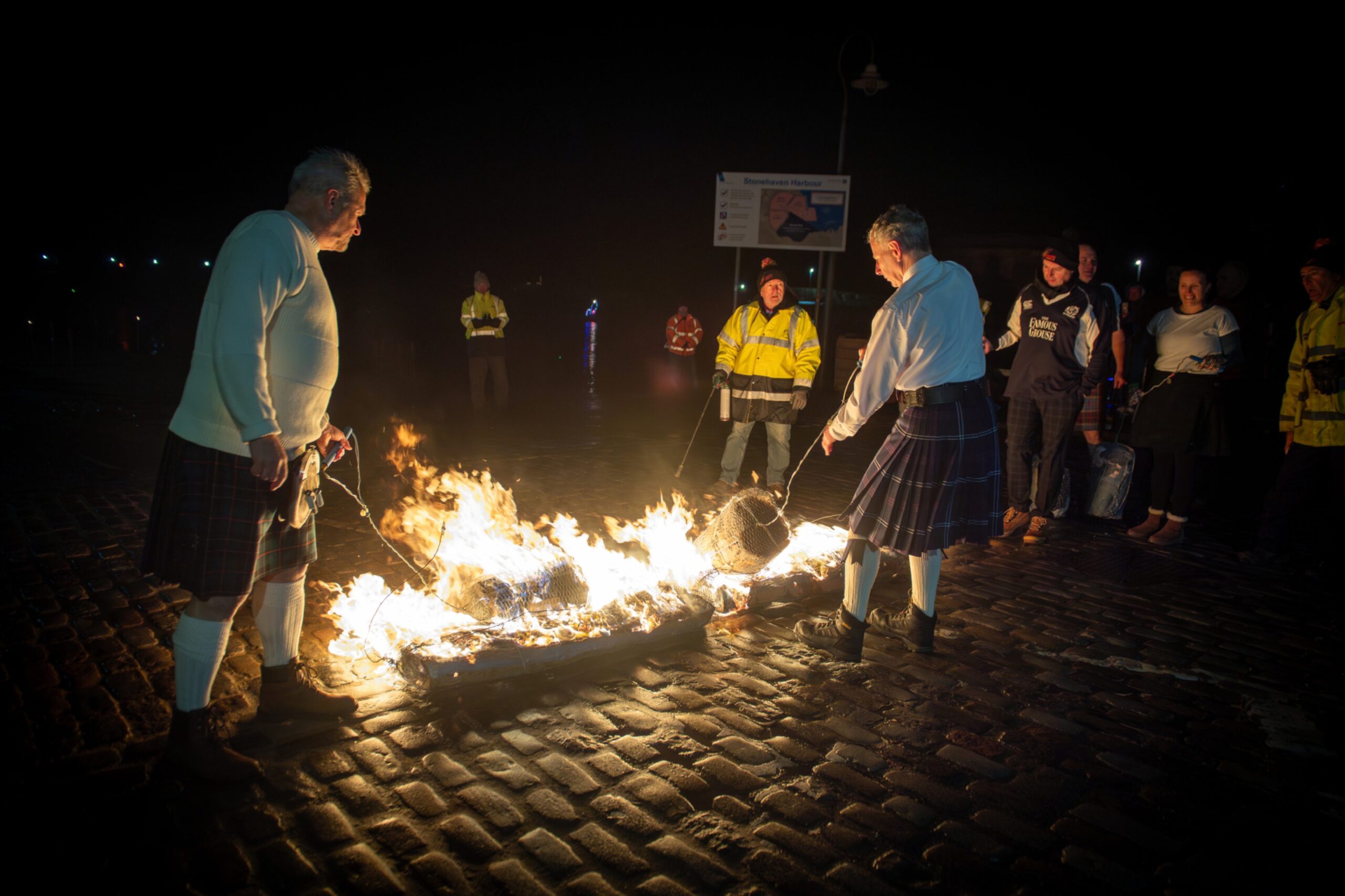 Fireball swingers light the first fireballs at Stonehaven Harbour before the Stonehaven Fireballs Hogmanay celebrations, January 1 2026.