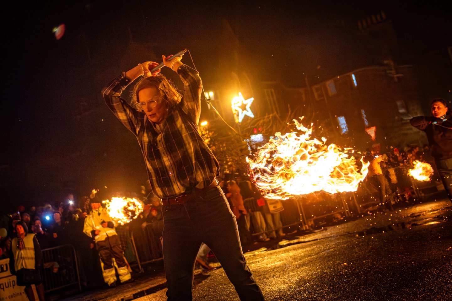 Fireball swingers march along Stonehaven High Street, spinning flaming fireballs during the Stonehaven Fireballs Hogmanay celebrations, January 1 2026.