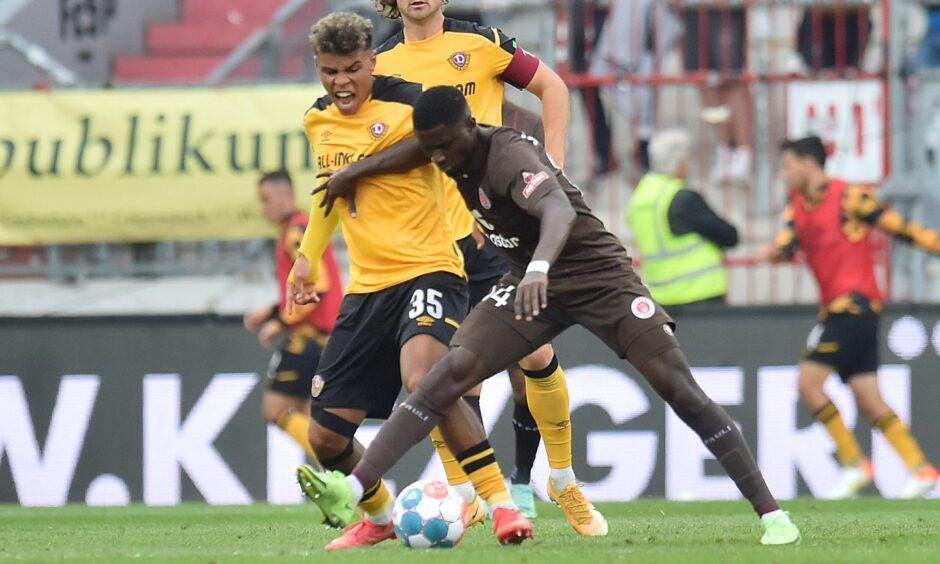 New Aberdeen FC recruit Afeez Aremu shields the ball while playing for St Pauli.
