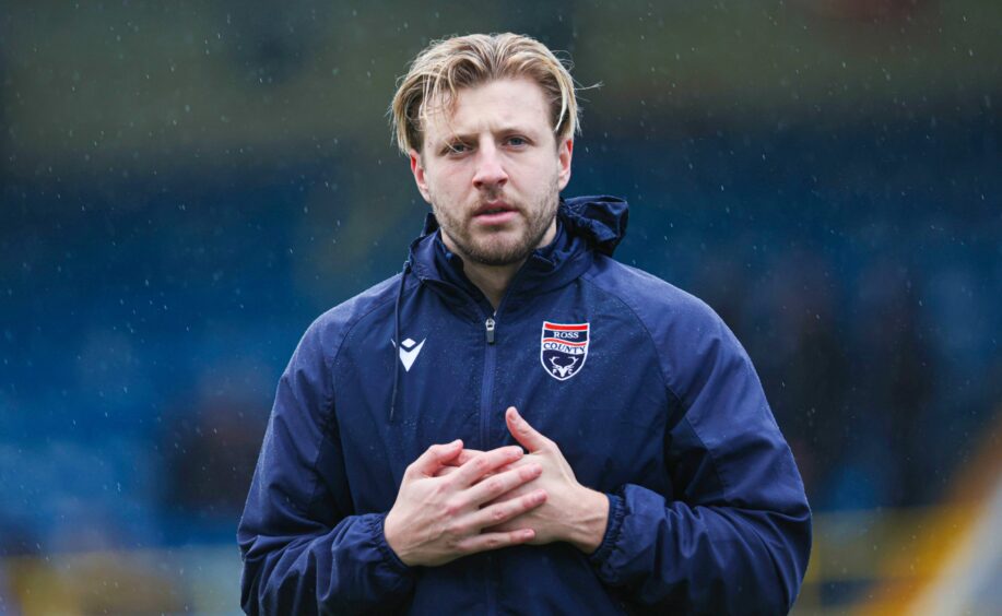 Sean Mackie warming up ahead of Ross County's SPFL Championship match at Morton at Cappielow Park, Greenock, on January 31, 2026.