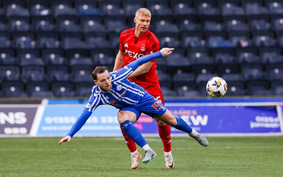 Aberdeen's Sivert Heltne Nilsen (R) and Kilmarnocks Bruce Anderson in action in 3-0 loss at Rugby Park.