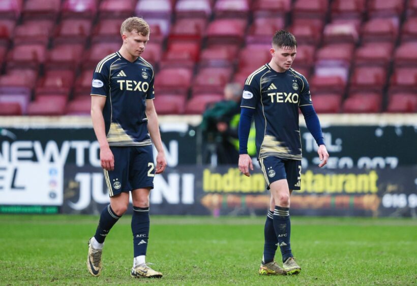 Aberdeen's Kjartan Mar Kjartansson (L) and Mitchel Frame look dejected at full after a 2-0 loss at Motherwell
