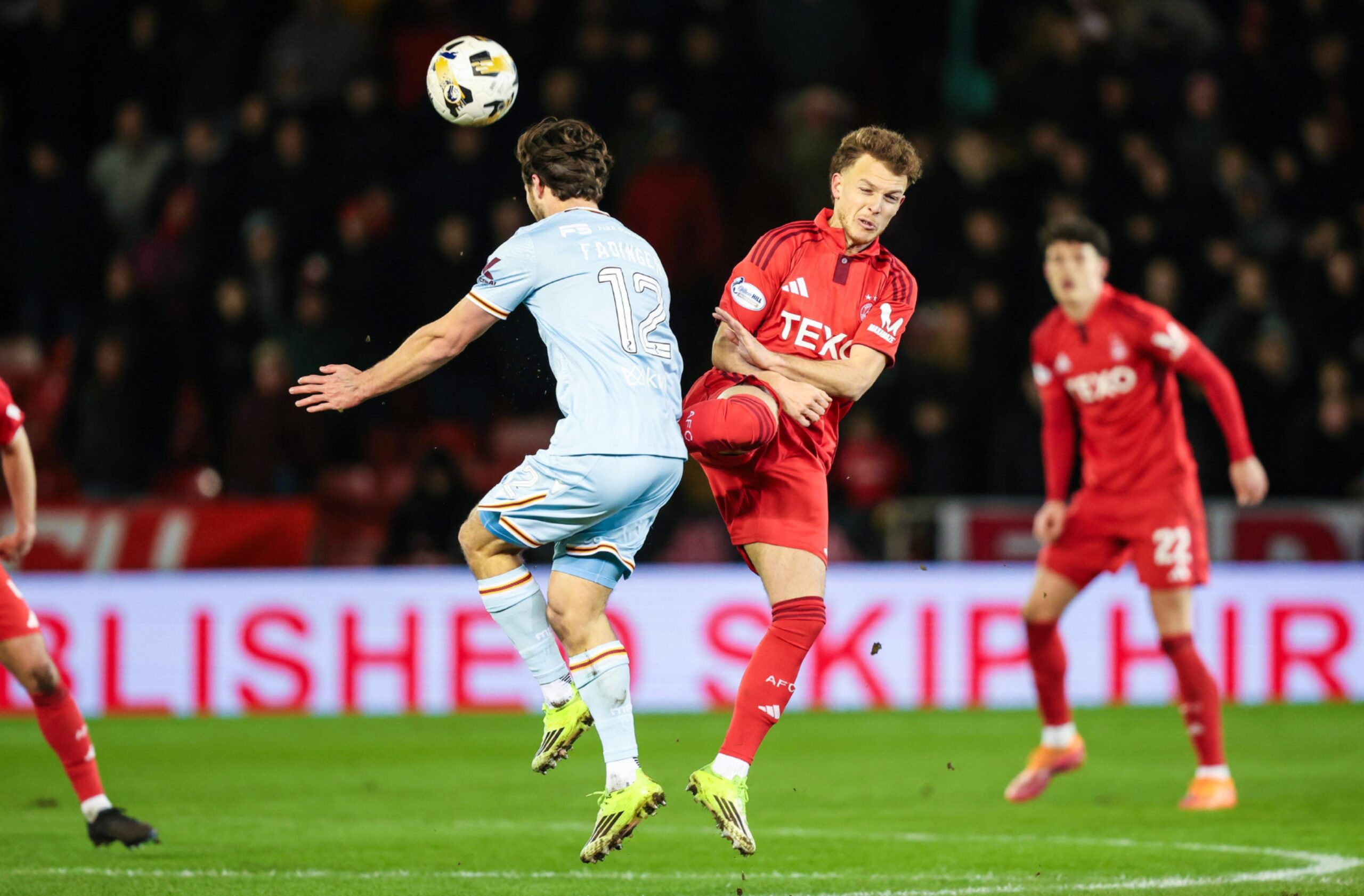 Aberdeen's Dennis Geiger fouls Motherwell's Lukas Fadinger - eventually receiving a straight red card. Image: SNS.