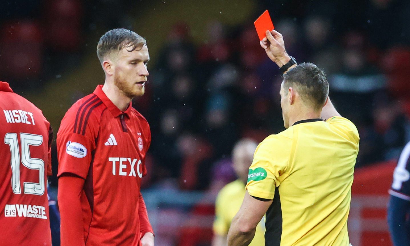 Referee Steven McLean shows a red card to Aberdeen's Liam Morrison against Dundee.