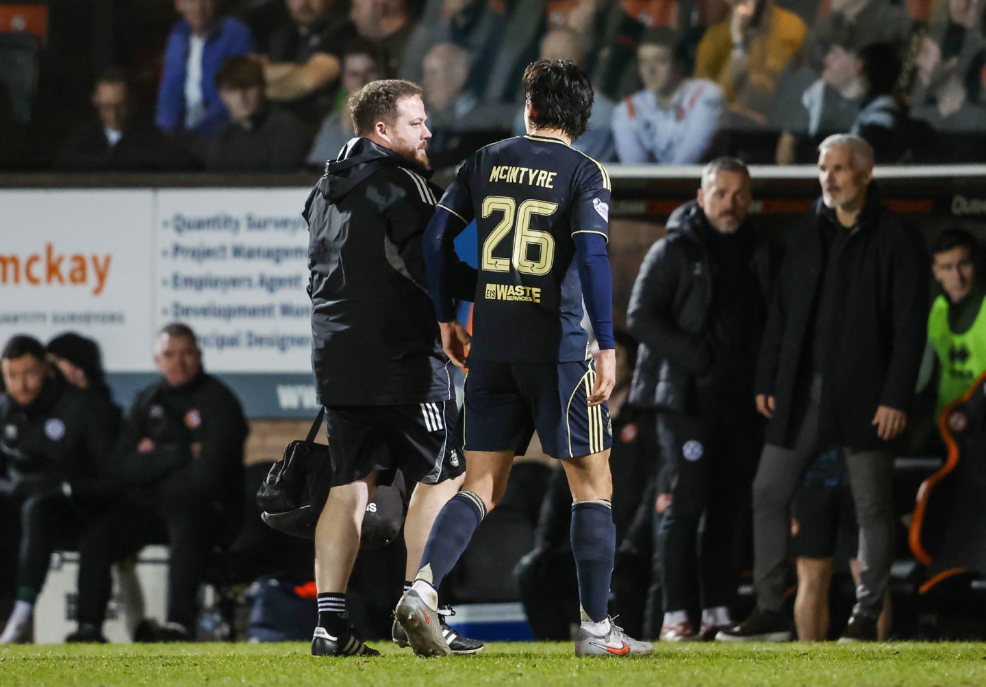 Aberdeen's Tom McIntyre is substituted off due to injury in the 0-0 draw at Dundee United. 