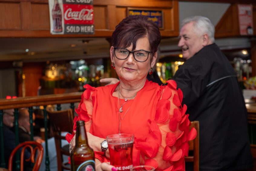 Linda King sitting down.