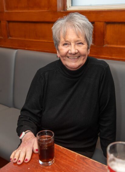 Ann Riddle sitting down.