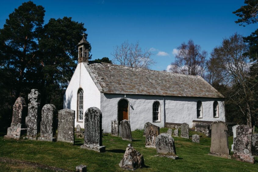 Gravestones in front of the Loch Insh Old Kirk 