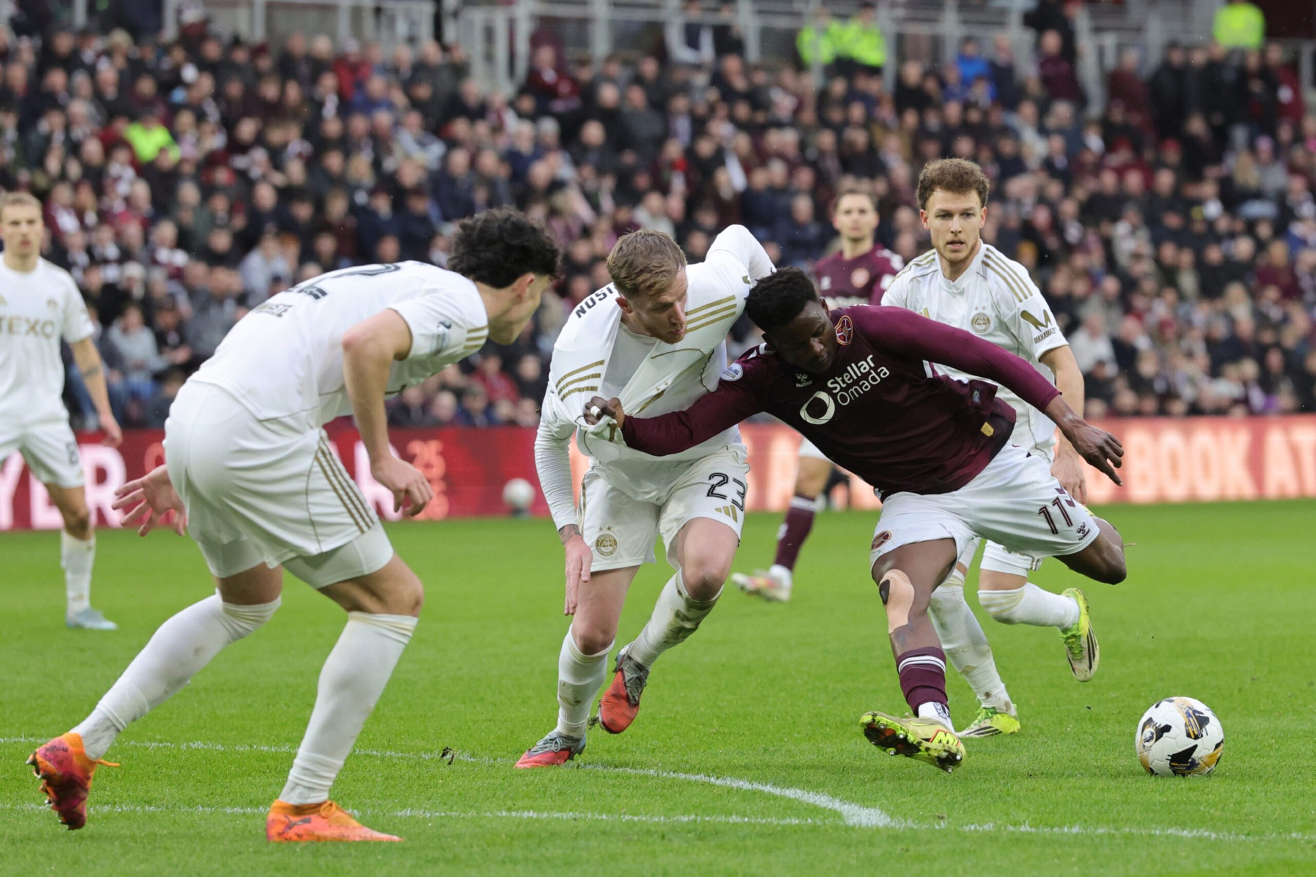Heart of Midlothian's Pierre Landry Kabore (third from right) has an attempt at goal against Aberdeen.