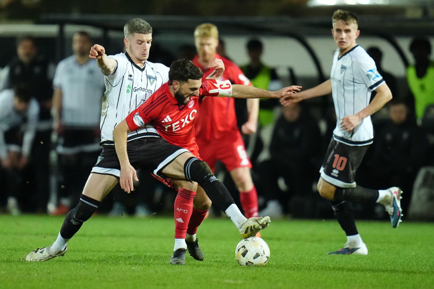 Graeme Shinnie of Aberdeen and Charlie Gilmour of Dunfermline Athletic.