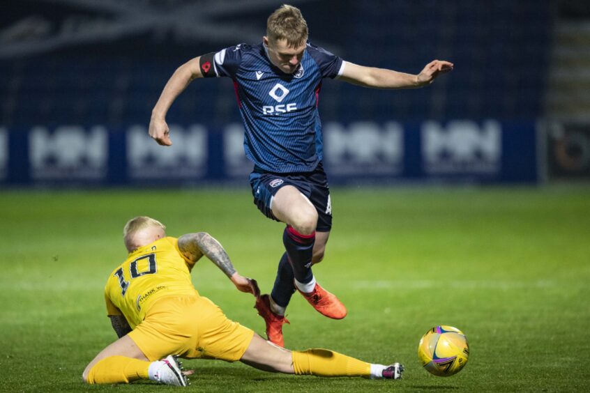 Ross County's Josh Reid is tackled by Craig Sibbald during an SPFL Scottish Premiership match between Ross County and Livingston at the Global Energy Stadium, Dingwall, on November 6, 2020.