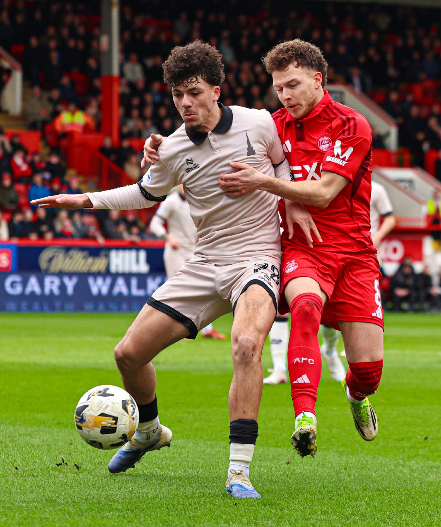 Falkirk's Filip Lissah and Aberdeen's Dennis Geiger in action at Pittodrie.