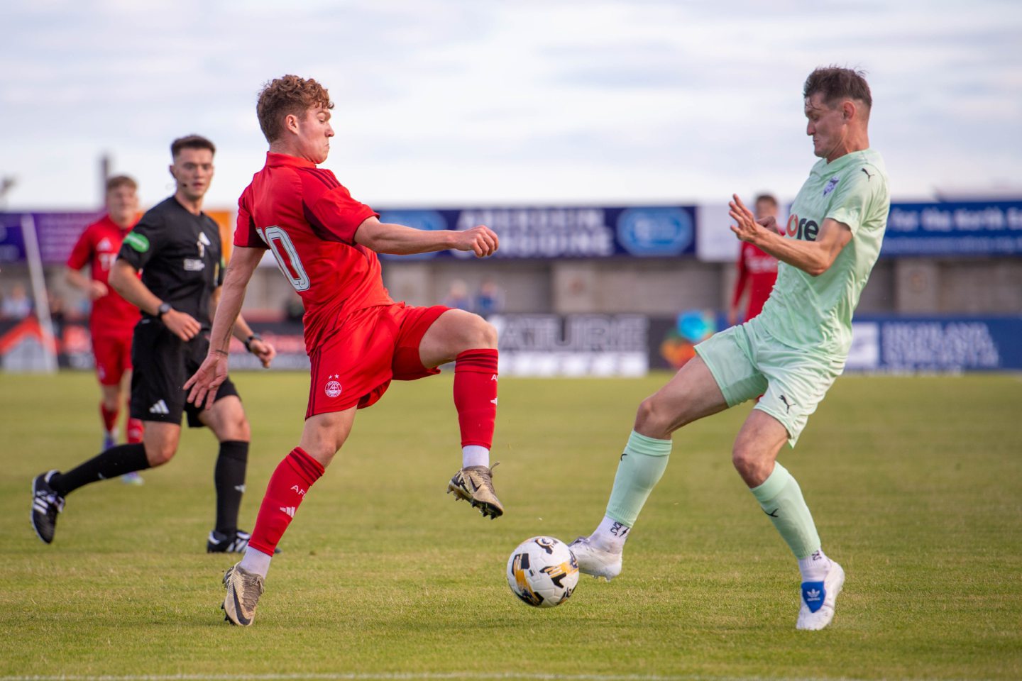 Aberdeen's Findlay Marshall challenging for the ball.