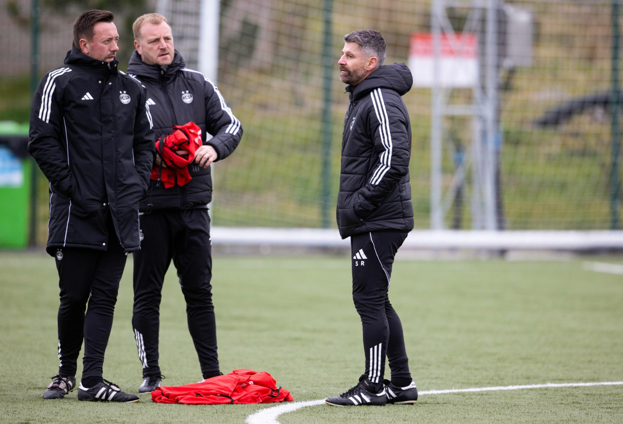 Aberdeen coach Ian Burchnall, assistant Brian Kerr and head coach Stephen Robinson during an training session at Cormack Park.