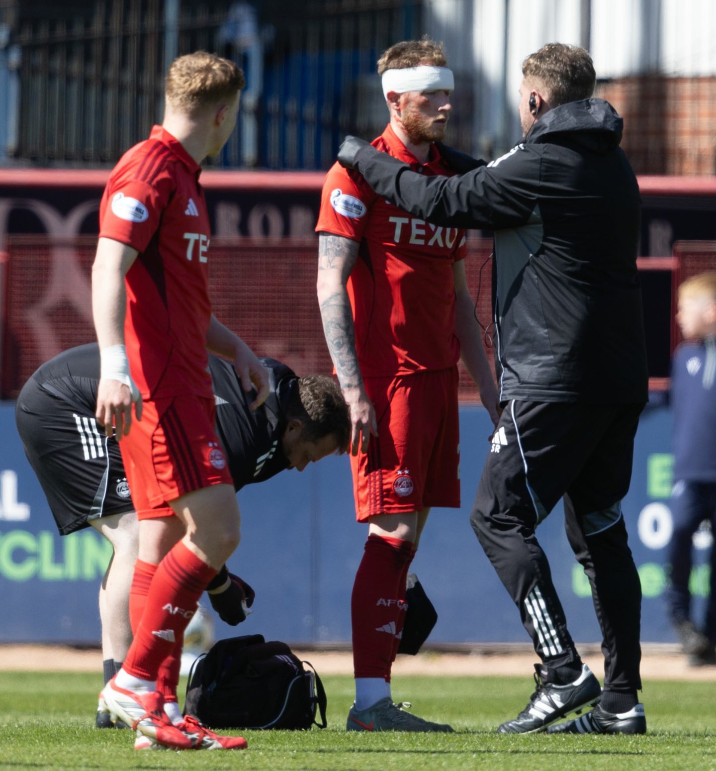 Aberdeen's Liam Morrison suffers a head knock during a Premiership match against Dundee at Dens Park. 