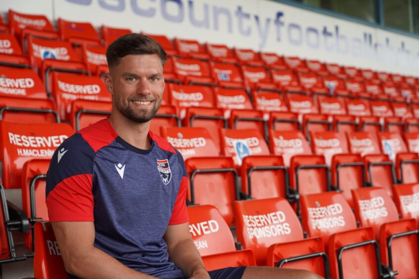 Midfielder Jack Turner pictured sitting in the main stand of the Global Energy Stadium, Dingwall, after signing for Ross County from Woking, on June 5, 2026.