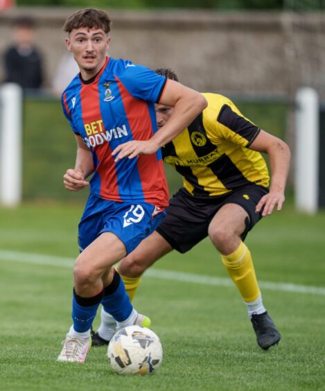 Striker Morgan Bates, who is on loan at Inverness Caledonian Thistle from Swansea City, has the ball at his feet in a pre-season friendly against Nairn County at Station Park, Nairn, on June 23, 2026.