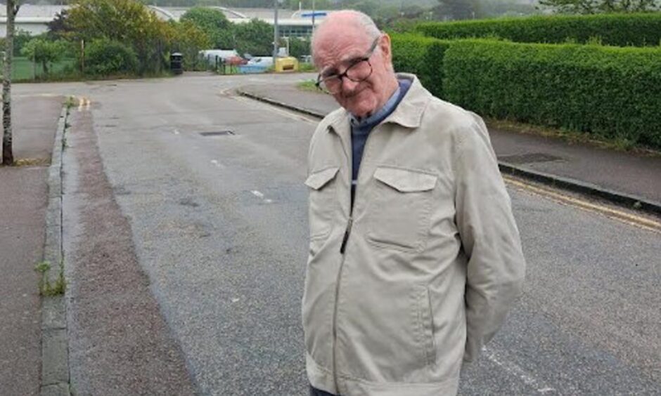 John Ewing standing on street.