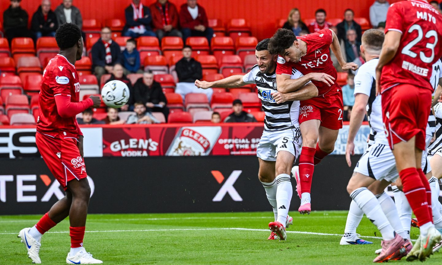 Aberdeen's Dan Happe (R) scores to make it 1-0 in the Premier Sports Cup match against Queen's Park at Pittodrie.