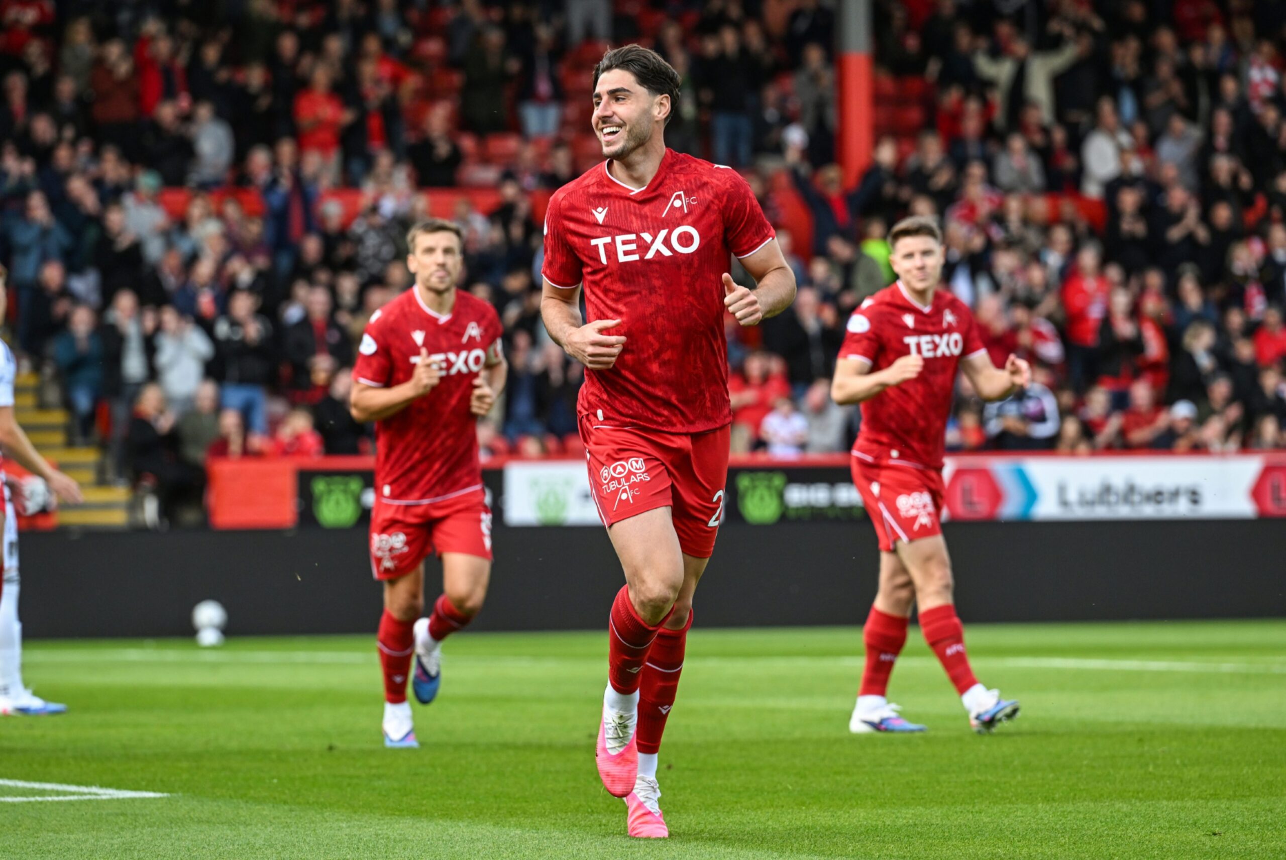 Aberdeen's Dan Happe celebrates after scoring to make it 1-0 against Queen's Park.