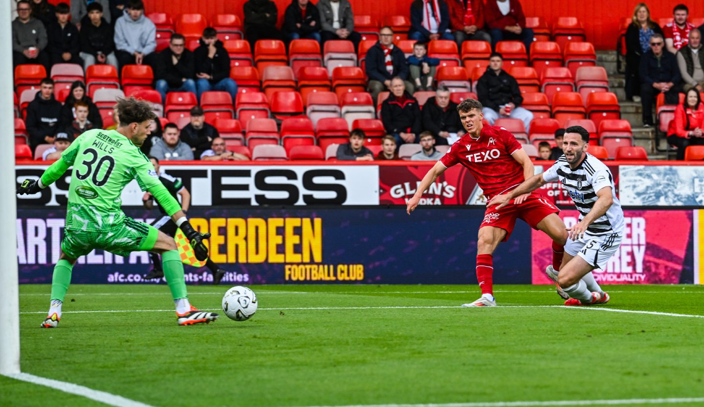 Aberdeen's Lewis Smith scores to make it 2-0 against Queen's Park in the Premier Sports Cup.