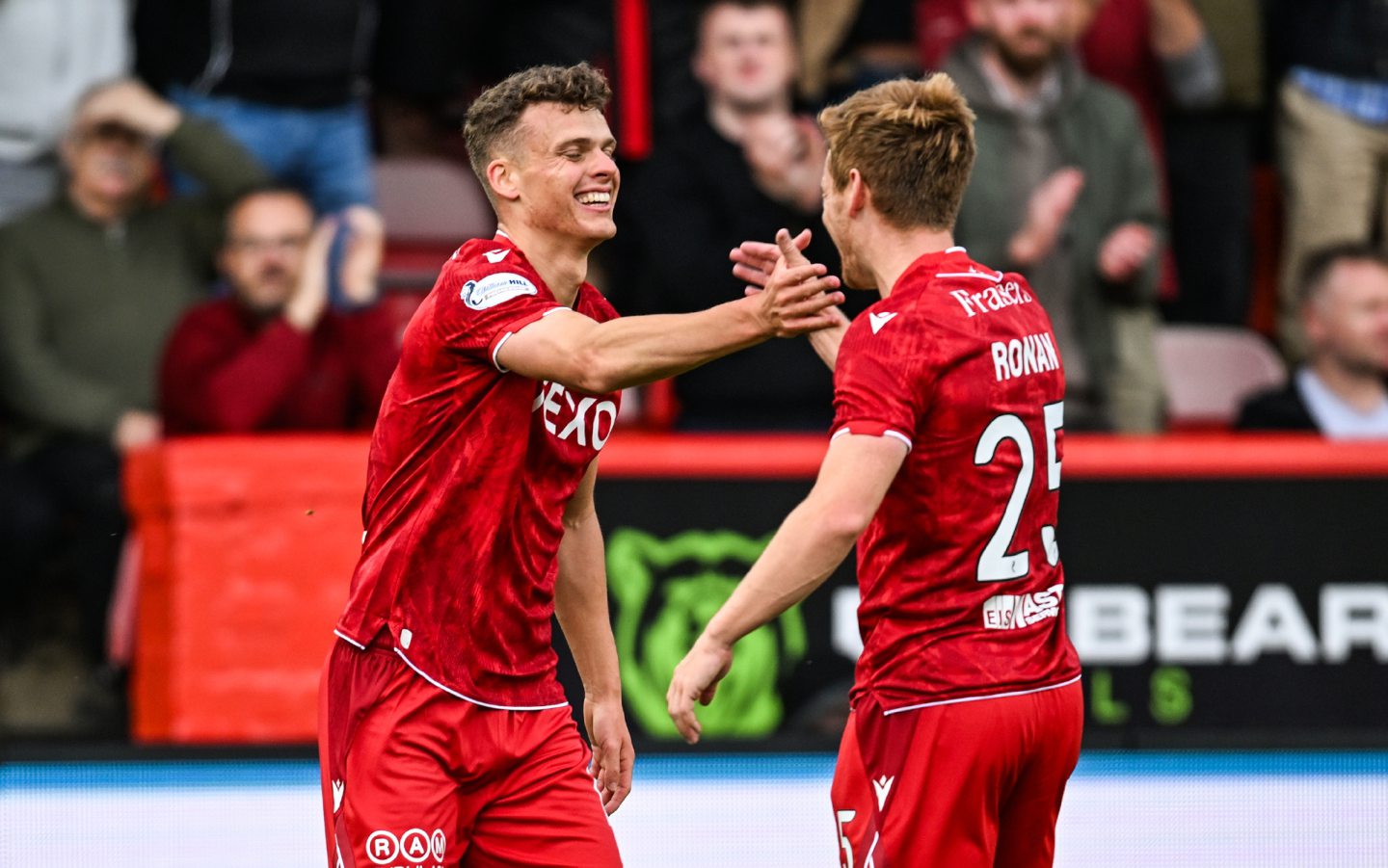 Aberdeen's Lewis Smith (L) celebrates with Connor Ronan (R) after scoring to make it 2-0 against Queen's Park.