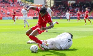 Aberdeen striker Toyosi Olusanya reacts to being treated like a ‘punch bag’