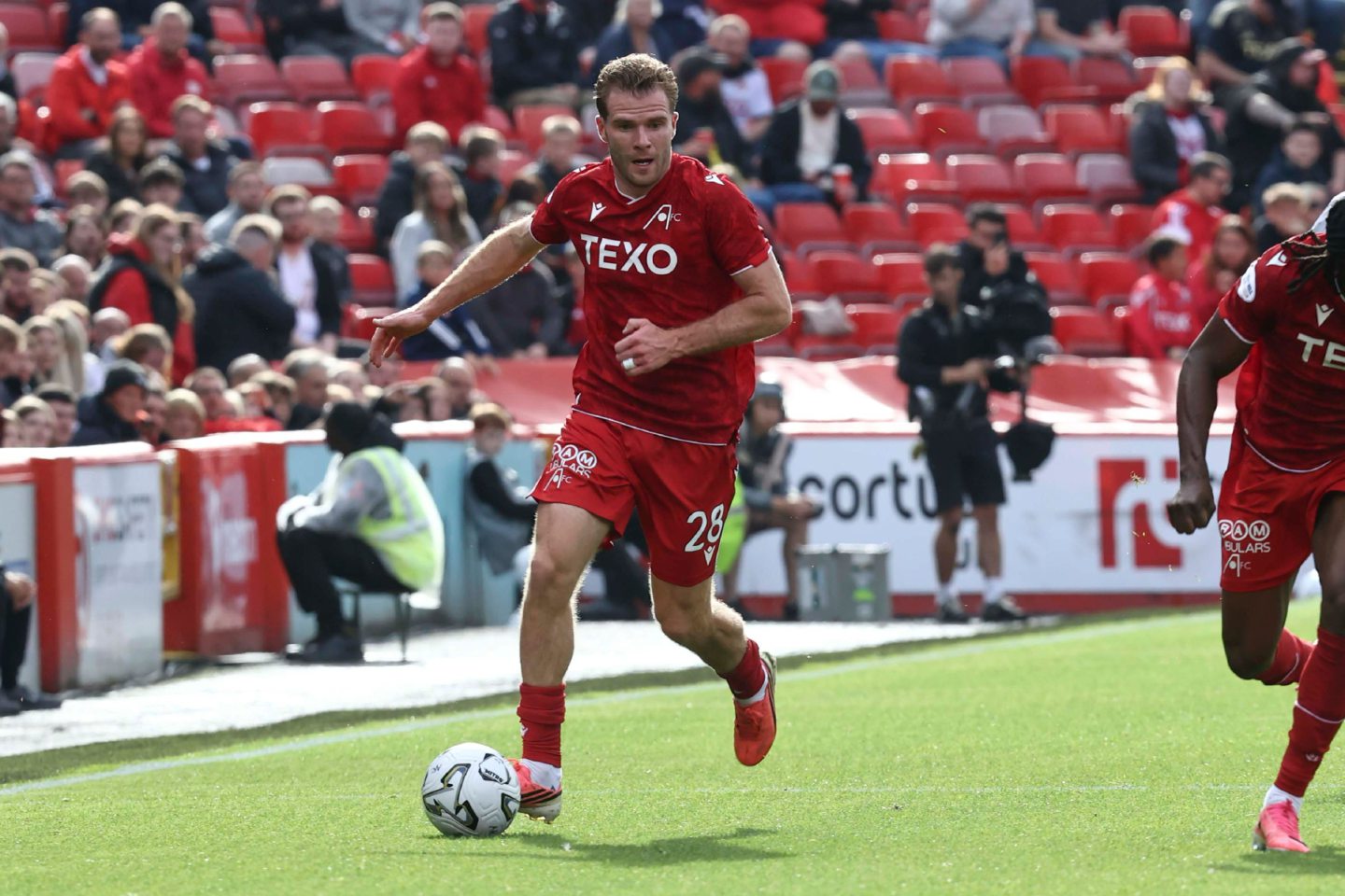 Chris Cadden going down the right flank for Aberdeen against Hearts. Image: Shutterstock.
