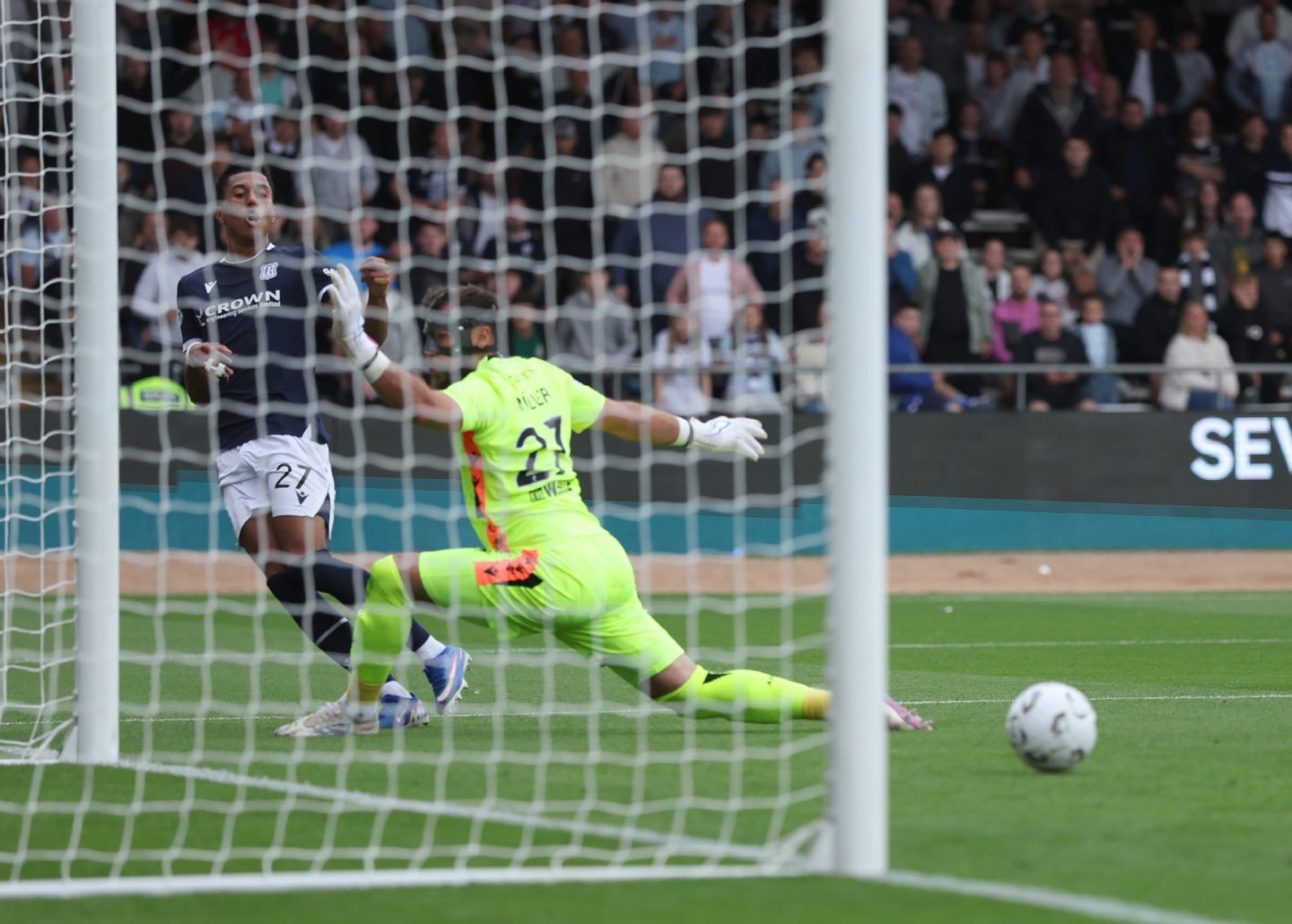 Dundee's Joe Bevan scores against Aberdeen.