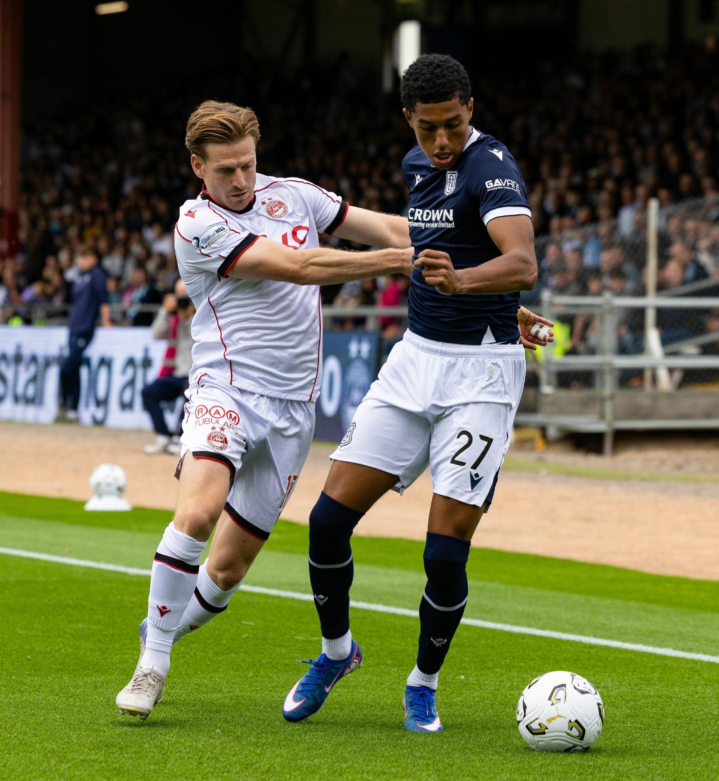Dundee's Joe Bevan (R) and Abedeen's Stuart Armstrong in action at Dens Park.